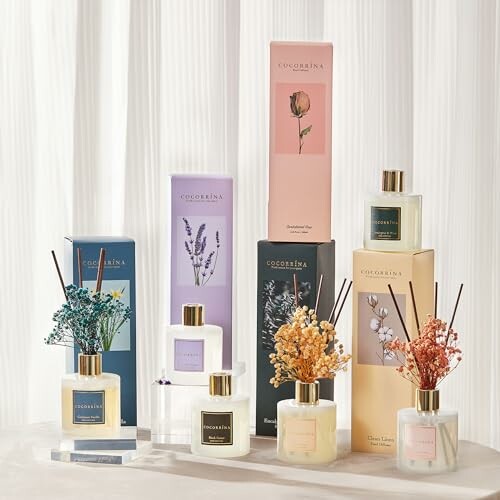 Assorted Cocodor reed diffusers with floral decorations and packaging.