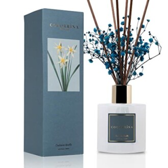 Cocorrina reed diffuser with box and floral sticks.