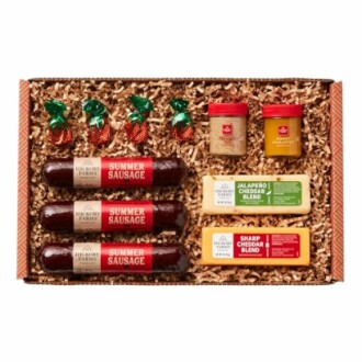 Gift box with summer sausage, cheese, mustard, and candies.