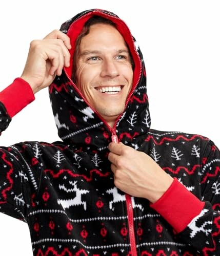 Person smiling in a festive reindeer onesie