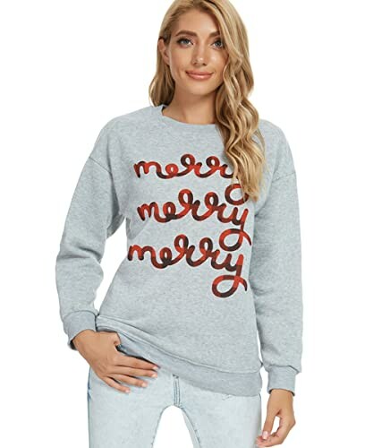 Woman wearing a gray sweater with 'merry' written in red